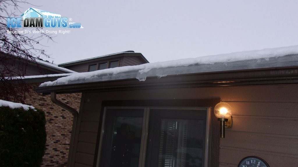 Layer of ice on a home's roof from the Ice Dam Guys®.