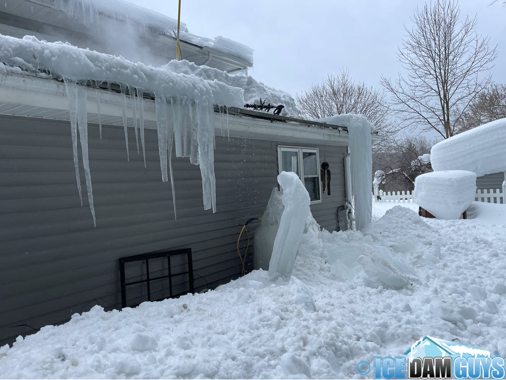 Huge ice dam and icicles on roof in Upstate New York