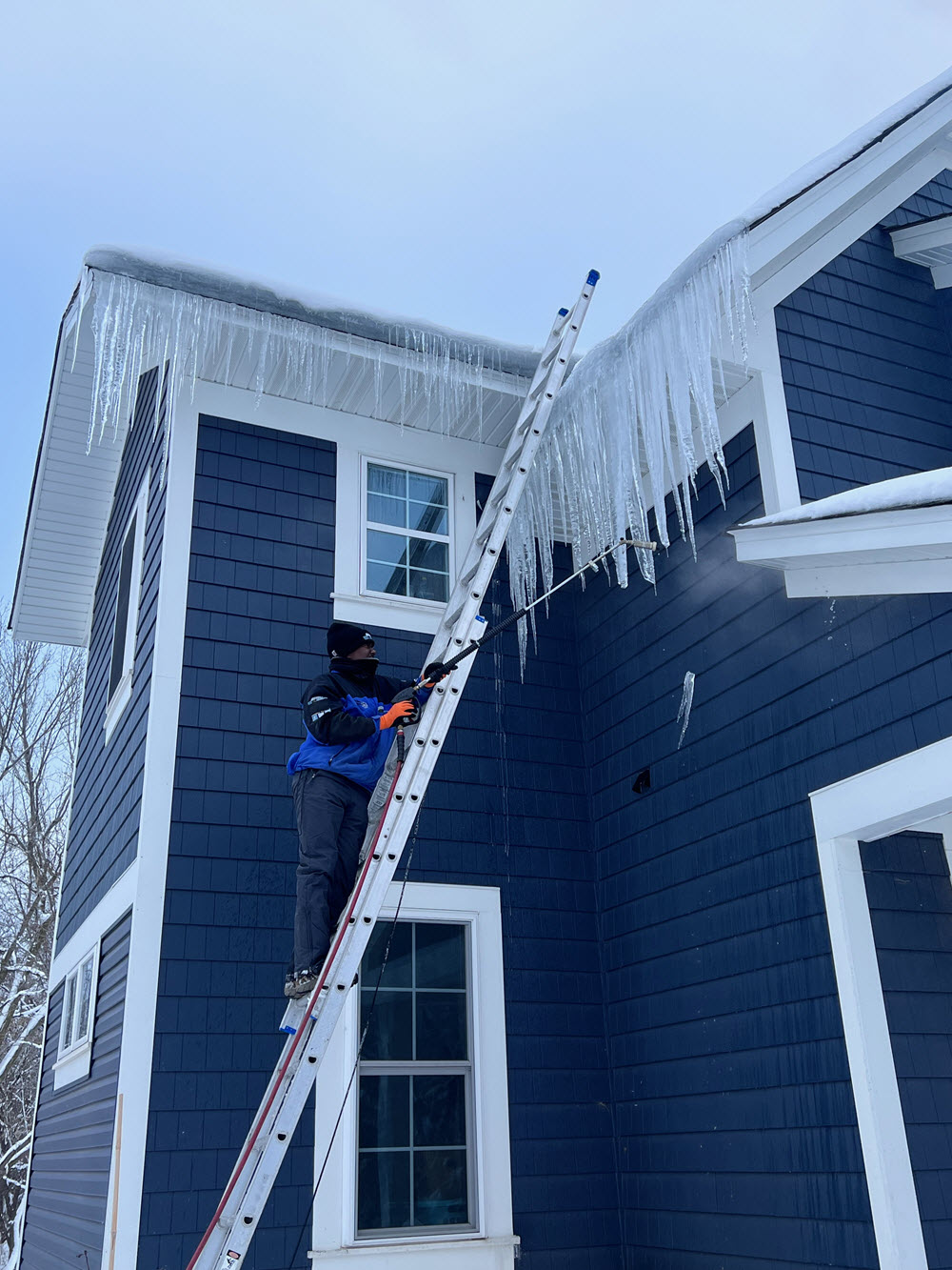 Removing ice dams in Minneapolis in January 2023