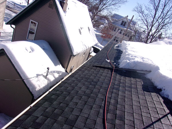 Ice dam removed from roof in Duluth, MN