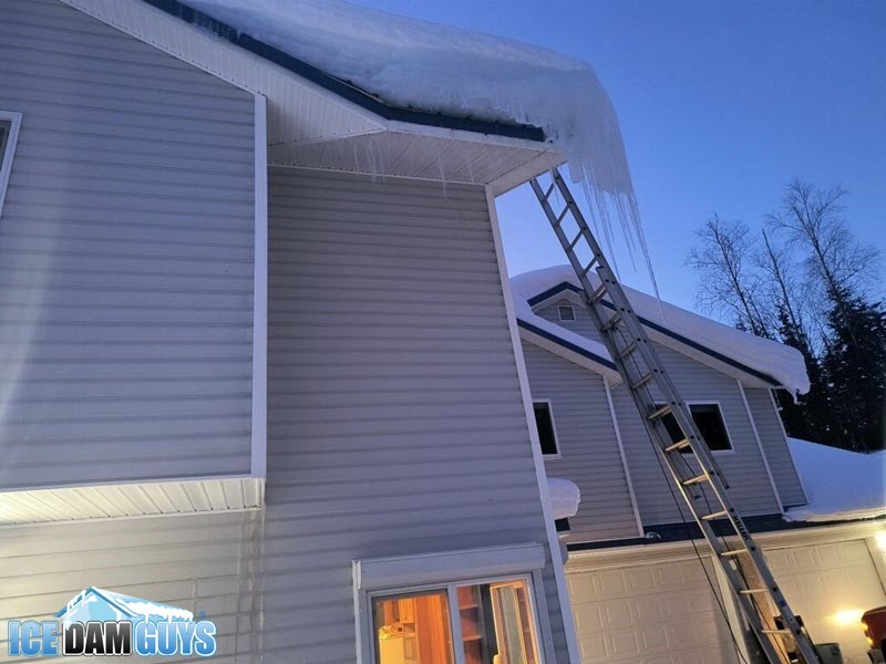 Ice dam on roof overhang at night - Anchorage, AK, 2024