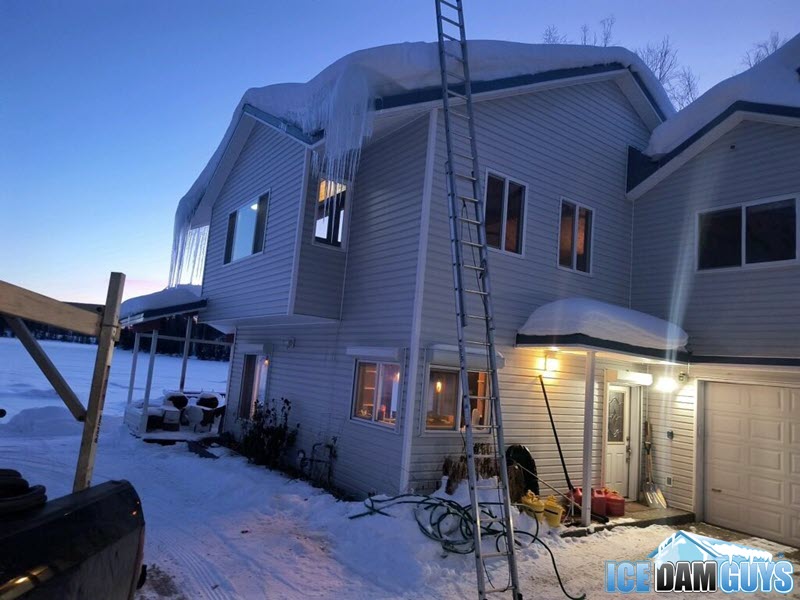 Removing ice dams in Anchorage in February, 2024