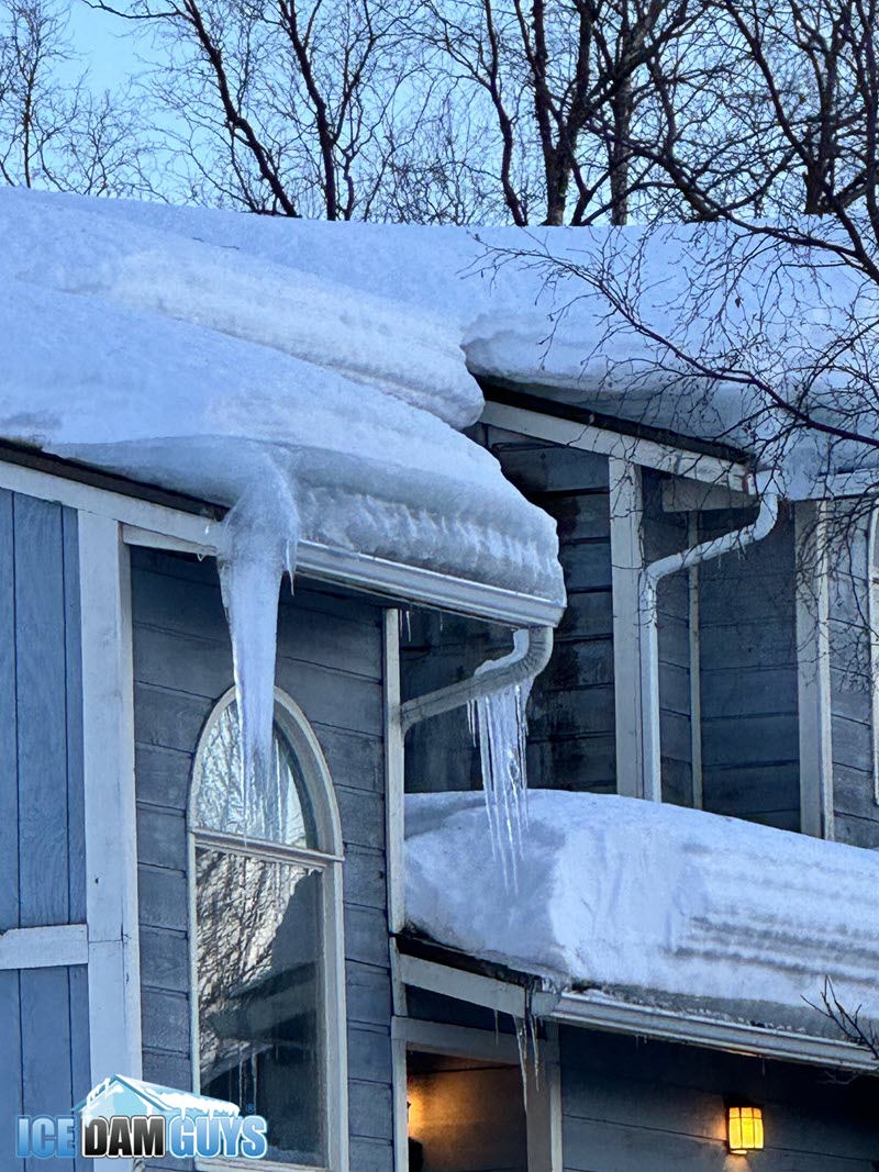 Thick ice dams on roof in Anchorage, February 2024
