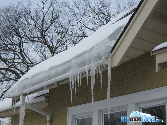 Frozen gutters with icicles