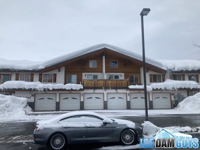 Ice dam and snow on roof of apartments in Park City, UT