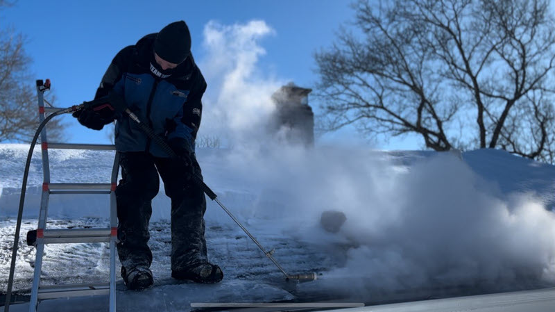 Steaming an ice dam on a home in Sharon, MA, January 2026